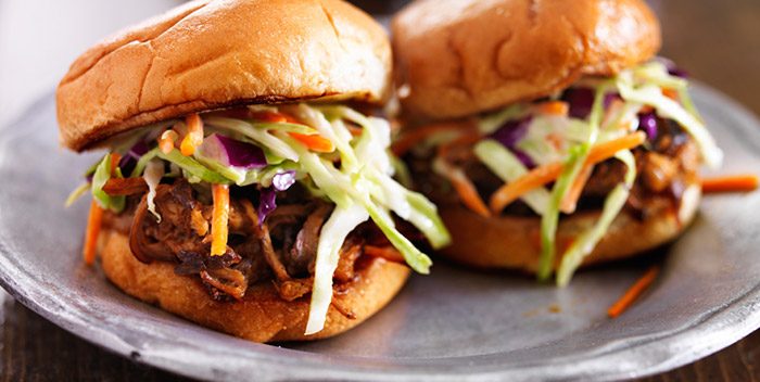 Two BBQ pulled pork sandwiches.