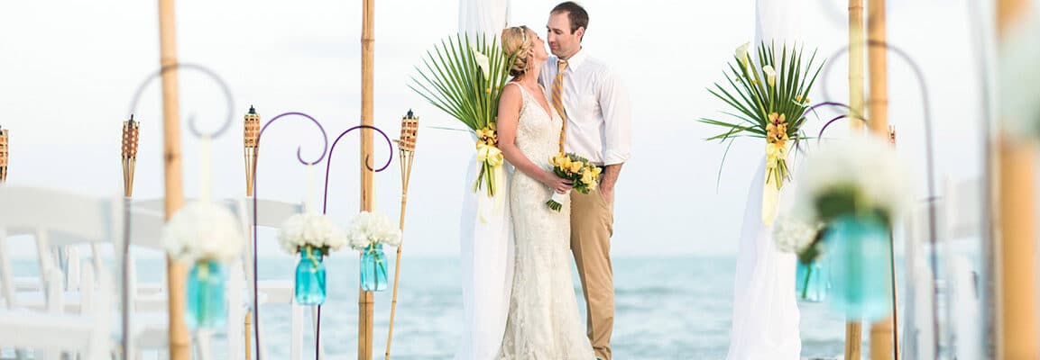 nick adams photography beach ceremony bride and groom altar pose