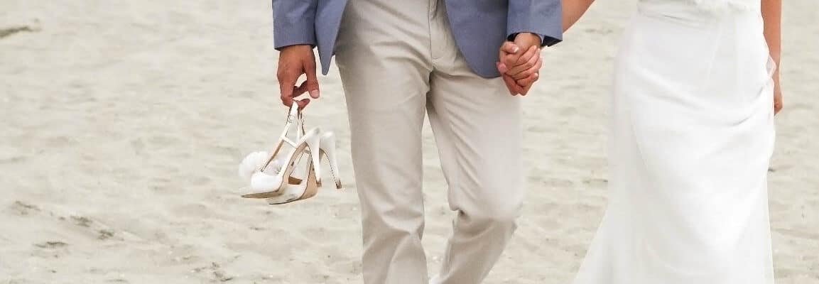 married on sanibel island bride and groom walking on beach