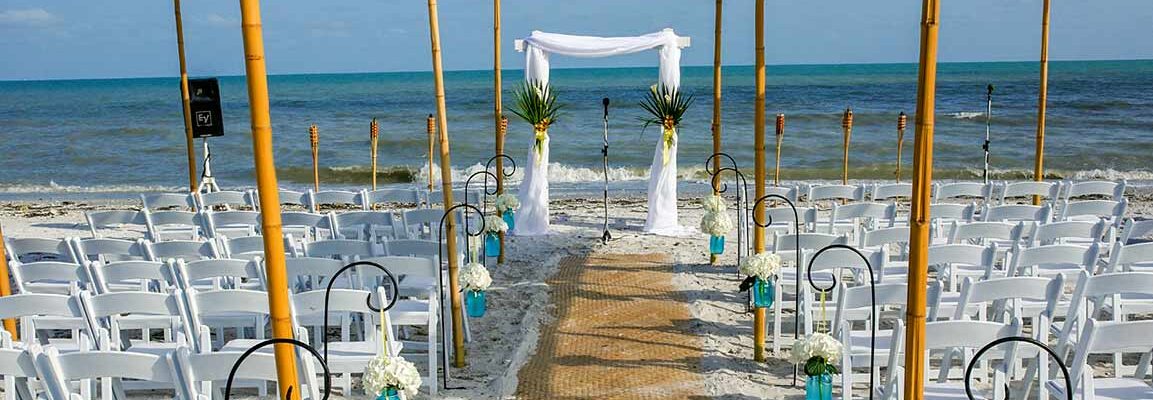 beach wedding set up sanibel island sundial resort sisel aisle shaded chairs