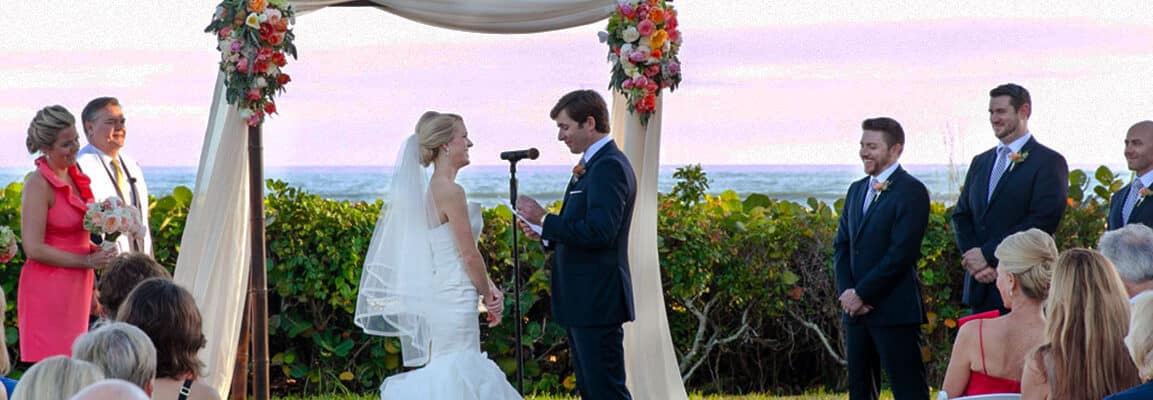 bride and groom married at sundial sanibel altar on lawn overlooking gulf