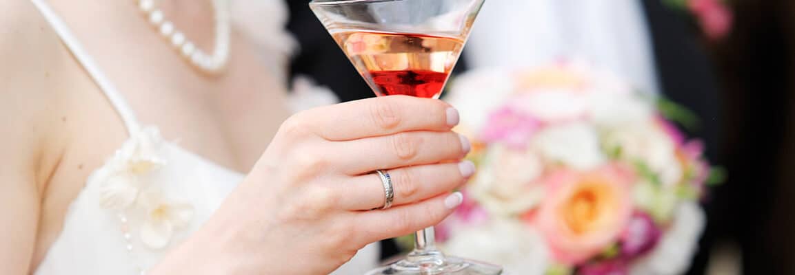 signature cocktail for wedding recption bride holding martini glass