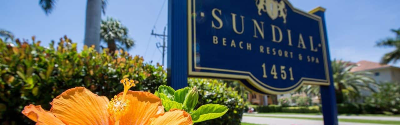sundial resort sign and hibiscus