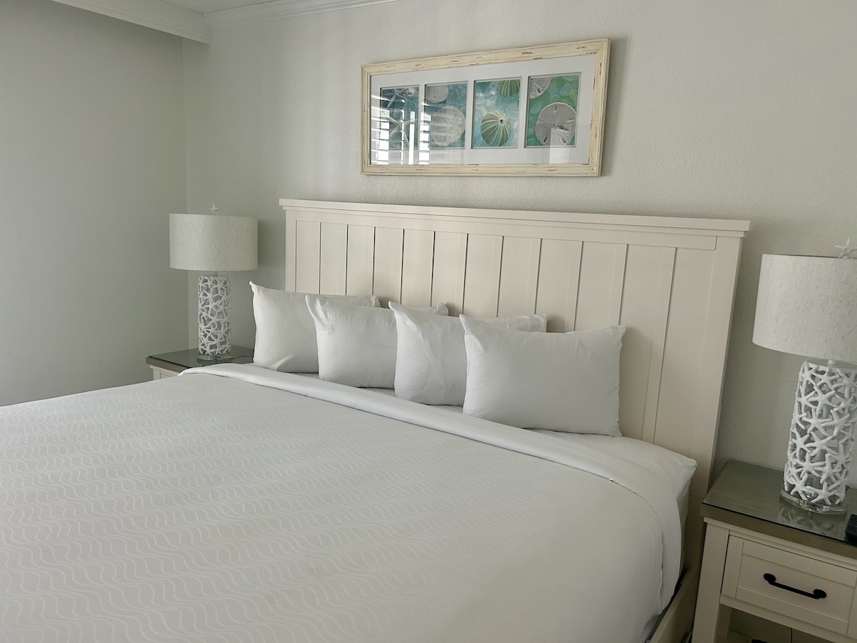 studio room type bed room showing bed and night stands