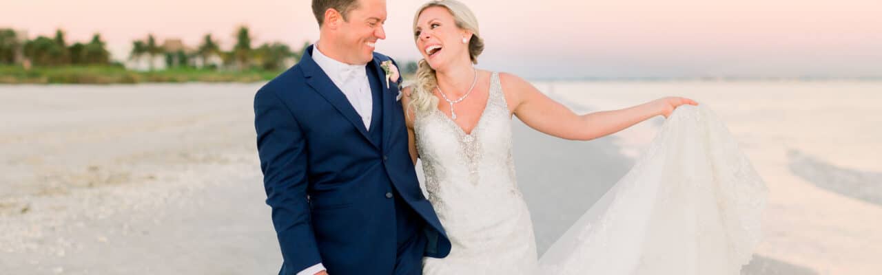 bride and groom beach portrait laugh fun candid justin and ashley wedding sundial sanibel island beach elegant moments by stella