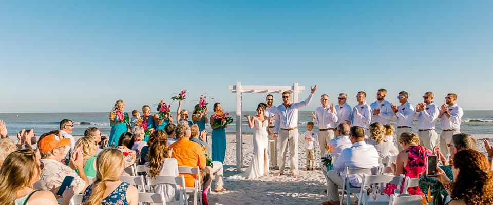 Brice & Stephanie’s Sundial Resort Beach Wedding sanibel wedding bride groom at altar gulf