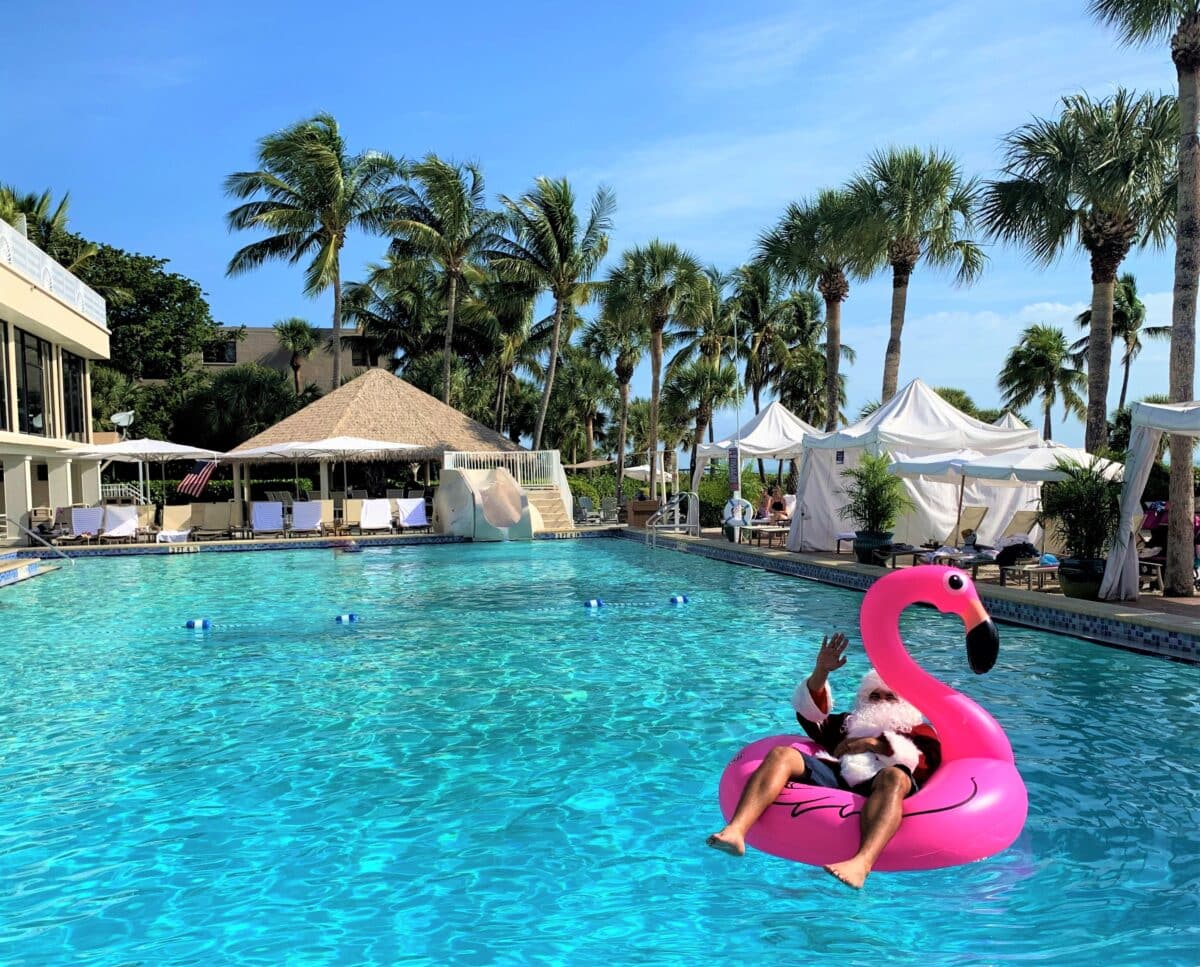 santa floating in pool on flamingo raft sundial sanibel