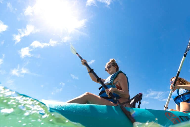 young woman kayaking gulg of mexcian sundial sanibel island