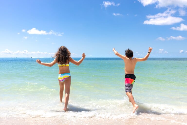 kids running into gulf sundial resort sanibel island