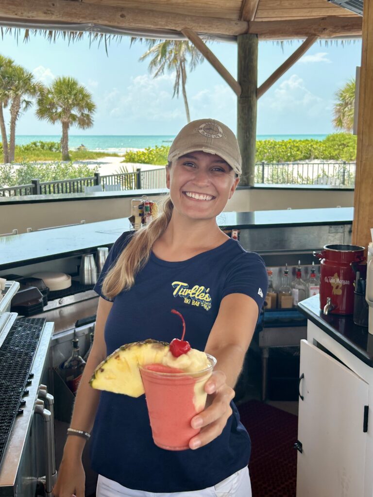 riley with miami vice summer cocktail at turtles tiki bar sanibel