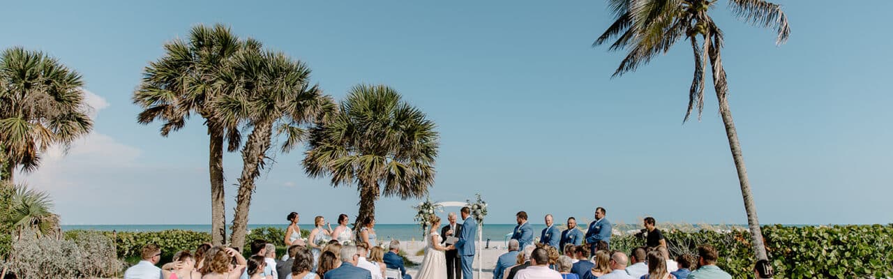 Jenna + Joseph's Wedding at Sundial resort taylor shea photo beach ceremony couple at altar