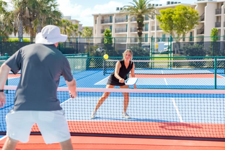 man and woman playing pickleball sundial resort