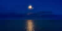 full moon over gulf of mexico sanibel island causeway v2