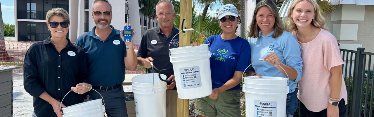 sccf beach bucket station at Sundial with staff posing