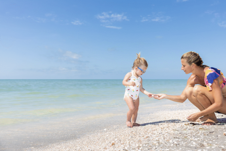 mother and daughter finding shell on beach sundial resort sanibel island
