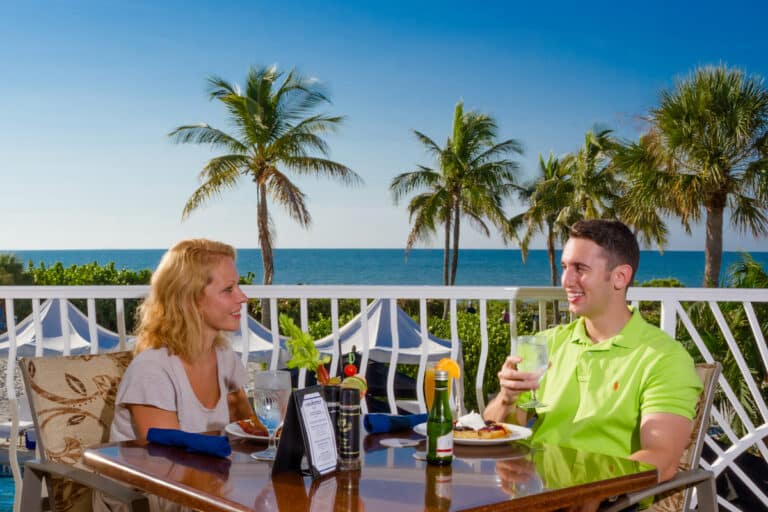 couple dining on terrace overlooking gulf sundial resort sanibel