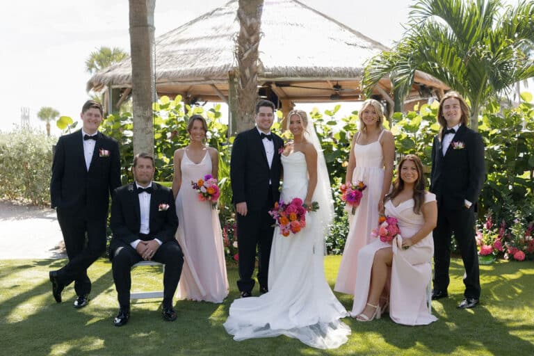 Maddie Briggs Photography bride and groom portrait with wedding party at sundial resort sanibel island