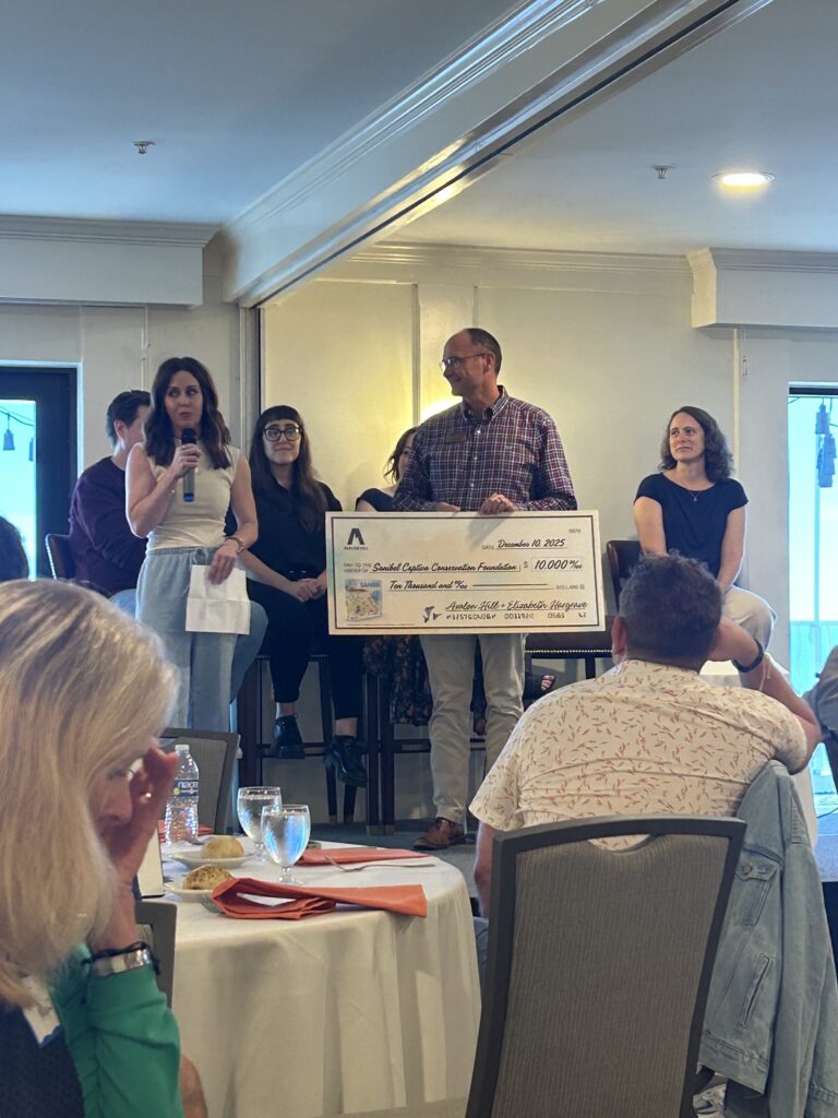 avalon hill hasbro present check to SCCF sanibel