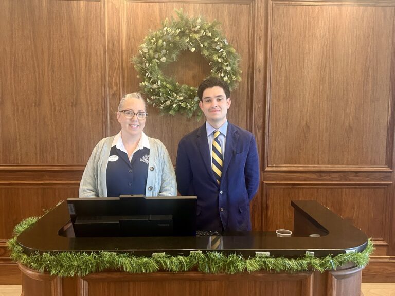 sundial front desk staff at checkin with garland and wreath