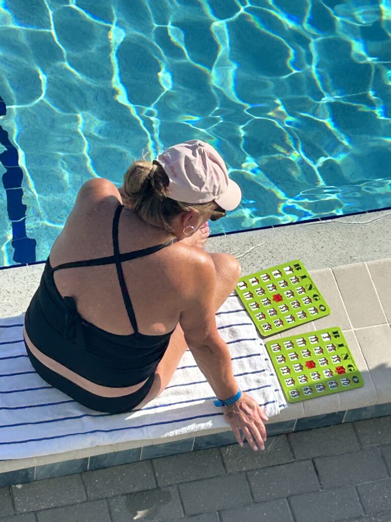 woman playing poolside bingo at sundial resort sanibel island