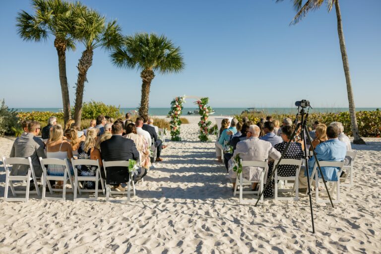 Austin and Kelsey’s wedding photo by Complete Wedding and Events Fort Myers wedding cermondy set up of aisle and altar with guests seated