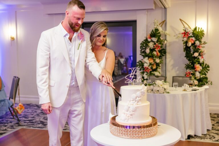 Austin and Kelsey’s wedding photo by Complete Wedding and Events Fort Myers wedding cake cutting reception
