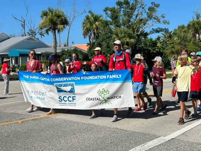 sccf group marching in fourth of july parade sanibel island photo credit - news press