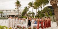 hannah and joey wedding by waking dreams films sundial resort sanibel island cermony view from behind look at couple, bridal party and those in attendance