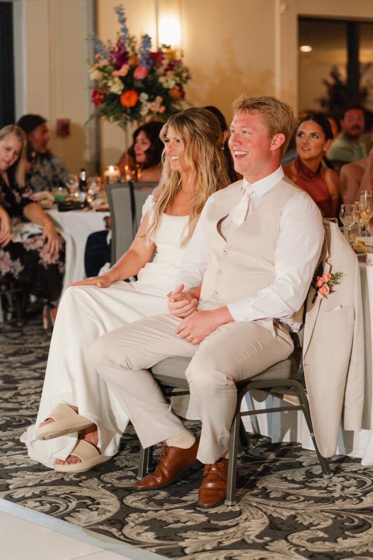 hannah and joey wedding by waking dreams films sundial resort sanibel island reception in ballroom couple laughing together