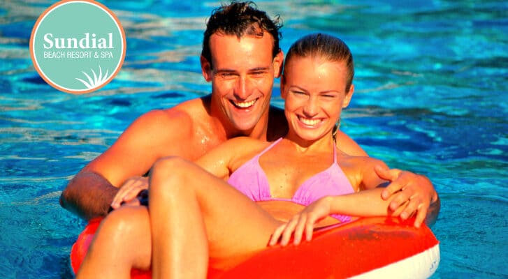 couple enjoying pool in float