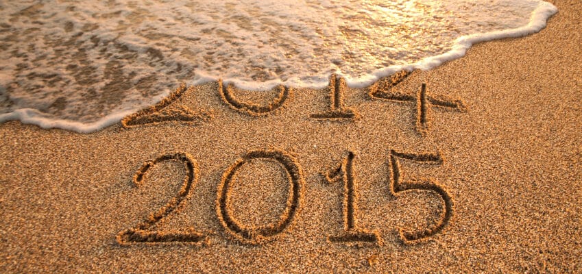 New year 2015 and old year 2014 written on the sand with wave